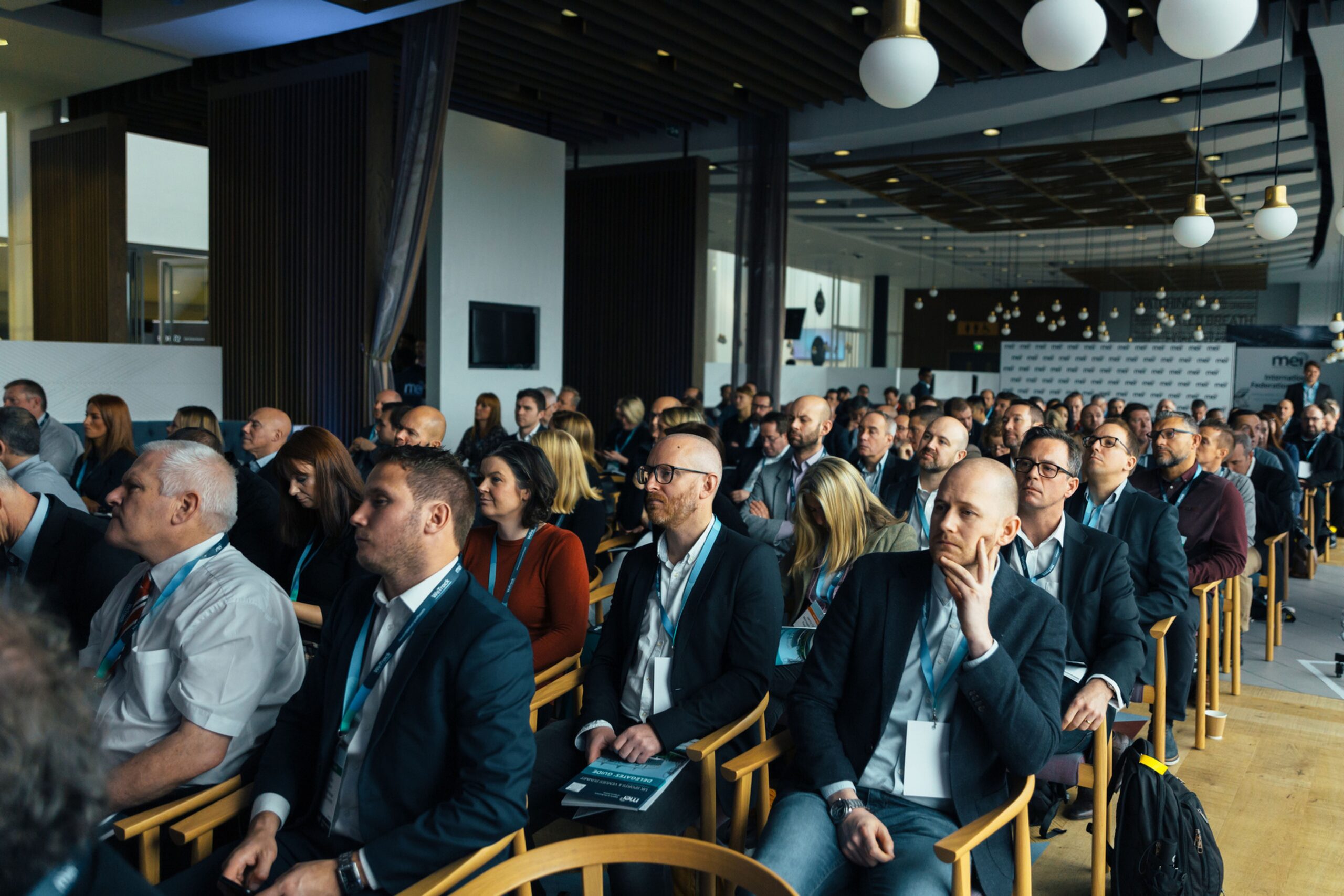 Audience seated at a trade-show conference session