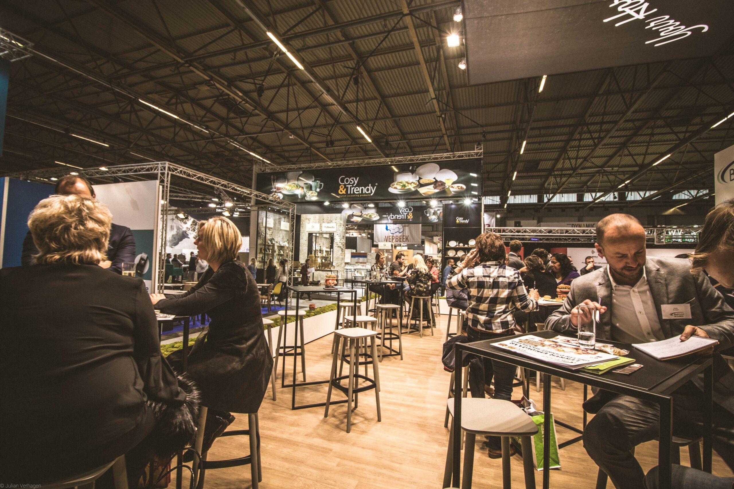 Exhibitors networking at a trade-show floor
